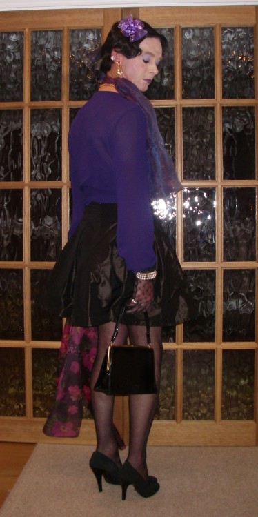Purple chiffon blouse and satin mini-skirt. The skirt has a pretty bow on the waist. I love my chiff