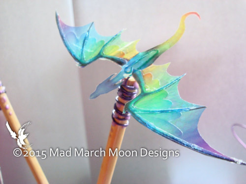 sosuperawesome:Iridescent dragon earrings, ear cuffs, hair clips, hair sticks and necklaces by MadMa