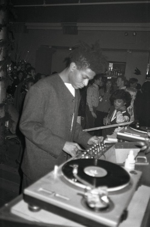 wantsneedsandloves:Jean-Michel Basquiat DJing at his birthday party at Area nightclub in 1985.