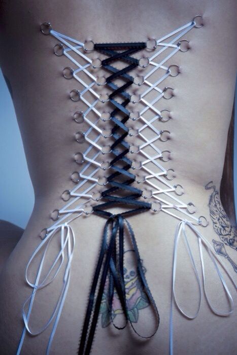 somehowbreathtaking:  OOoooooo. This is BEAUTIFUL work. I miss my corset piercings…. 