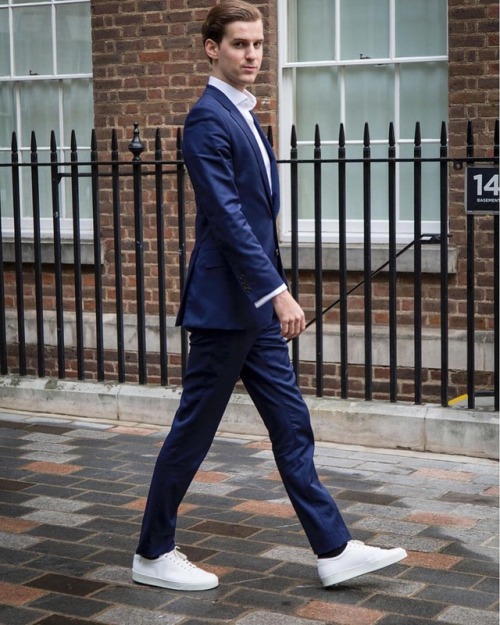 blue suit white sneakers