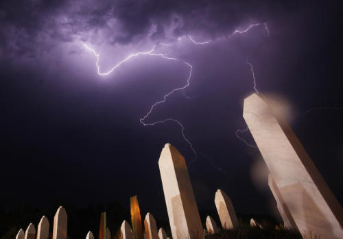 Lightning is seen during a storm under the Memorial Center in Potocari the night before a mass burial, near Srebrenica July 10, 2012. The bodies of 520 recently identified victims of the Srebrenica massacre will be buried on July 11, the anniversary of