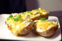 prettygirlfood:  Cheesy Twice-Baked Potatoes  Ingredients: 2 large baking potatoes, scrubbed and rinsed 4 slices thick cut bacon, diced into 1 inch pieces 1 tablespoon butter &frac14; cup milk &frac14; cup sour cream &frac12; cup grated cheddar cheese,