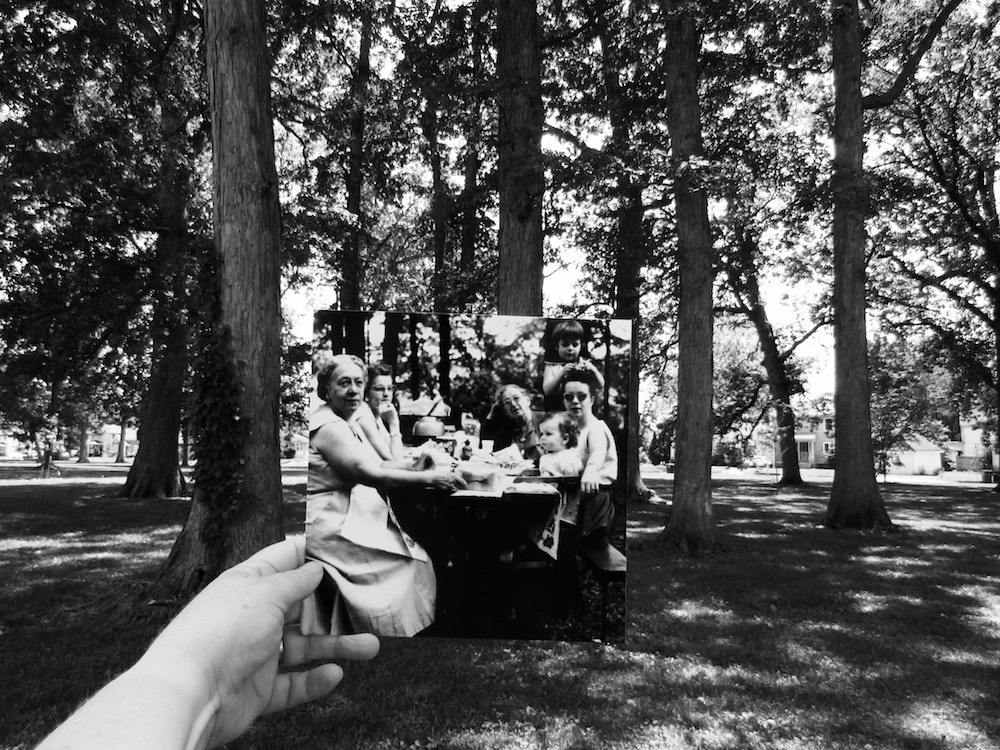 Dear Photograph, a 1957 summer picnic in the park with the women in my family and my dad, the prolific amateur photographer, capturing the moment. I am the young child in the seat hooked onto the table and have only an imagined memory of this moment....