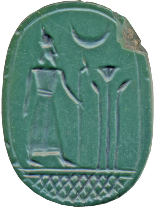 Underside of a green jasper scarab-amulet, depicting a ruler holding a staff before lotus plants, wi