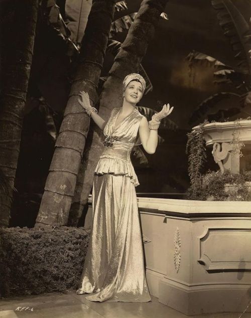 Diva, Inc.: KAY FRANCIS, posing in lamé.