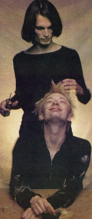 yorkeos:…“Photogenically,” Jonny says, looking over at Thom who is searching for volunteers to cut h