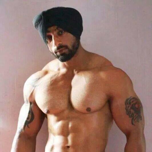 Stunningly handsome - mounds of pecs, sexy beard and nips are ideal.