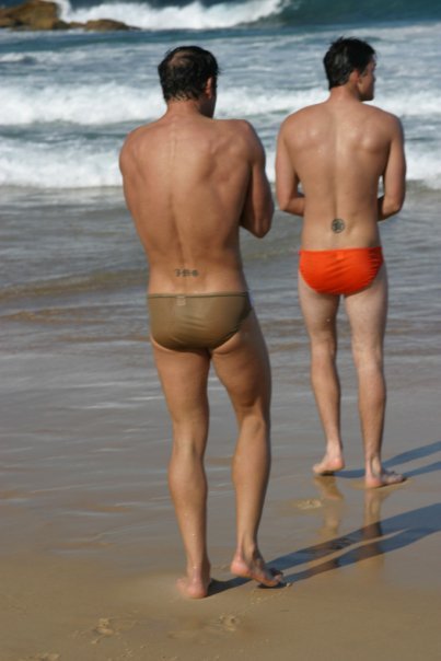 tautspeedos:  #beefcake #topnbot #couple #orange #speedos #tats #target