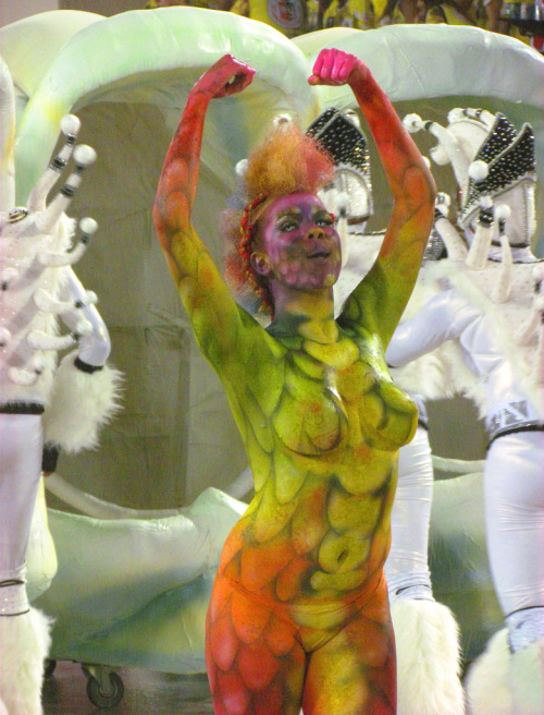 Topless and body painted at a Brazilian carnival, adult photos