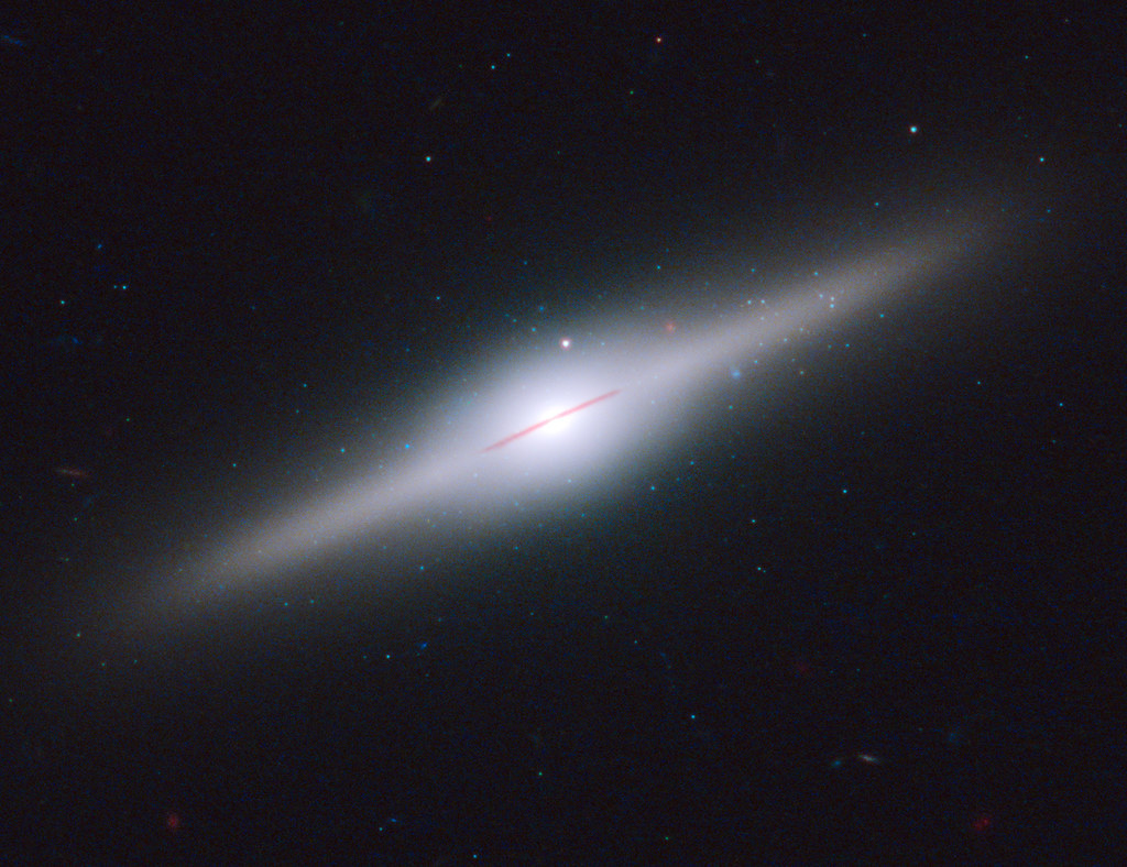 NASA’s Hubble Spots a Relic from a Shredded Galaxy by NASA Goddard Photo and…