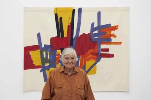 tawseet-al-sharq: Etel Adnan standing in front of her tapestry Le Depart