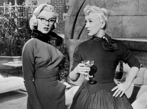 infinitemarilynmonroe:Marilyn Monroe and Betty Grable in a scene from How to Marry a Millionaire.