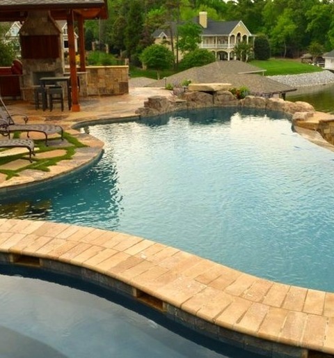 Pool - InfinityExample Of A Huge Classic Backyard Stone And Custom-shaped Infinity Pool Fountain Design