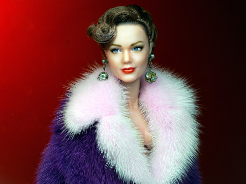 A repainted and restyled Angelina Jolie, Doris Day and Holliday Grainger by Noel Cruz in a coat by F