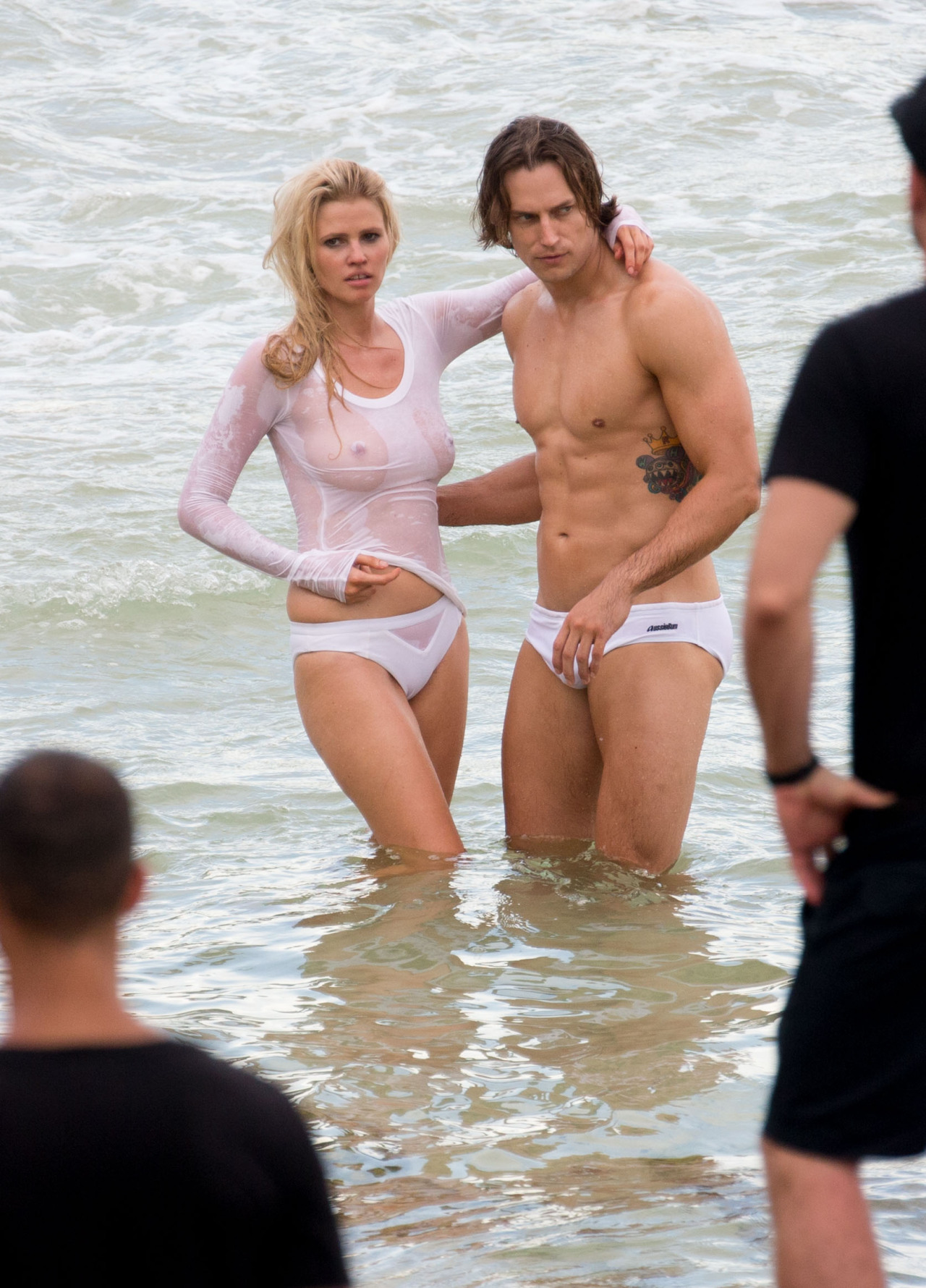 toplessbeachcelebs:  Lara Stone (Dutch Model) in a wet see-through top during a photoshoot