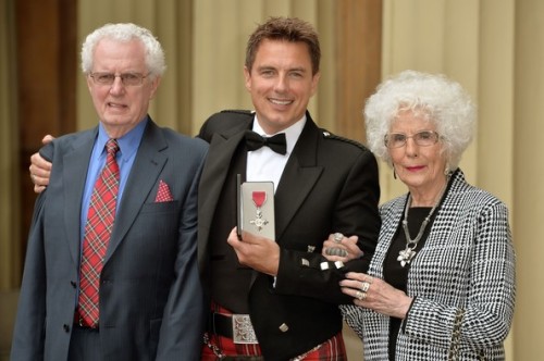 nixxie-fic:More New Pictures of John Barrowman getting his MBE from Princess Anne at Buckingham Pala