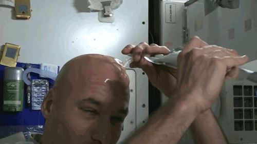aplusappmedia:The water sticks to his scalp like that because of physics: where there is no gravity, surface tension dominates. That means the otherwise weak bonding that happens during surface tension suddenly becomes strong enough for Parmitano’s