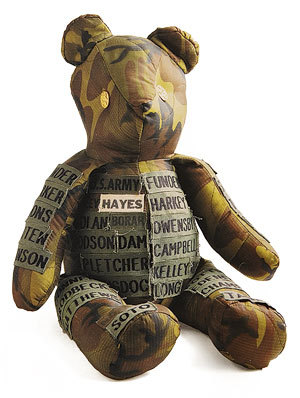 A teddy bear decorated with uniform name tapes which was left at the Vietnam War Memorial by a membe