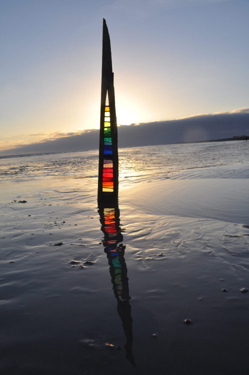 Colorful Patterns of Stained Glass Nestle Within Repurposed Sea Defense TimberBased in the coastal t