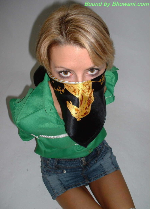 graybandanna:  Sabrina tied up in a green blouse with both a scarf cleave gag and a scarf over the nose gag 