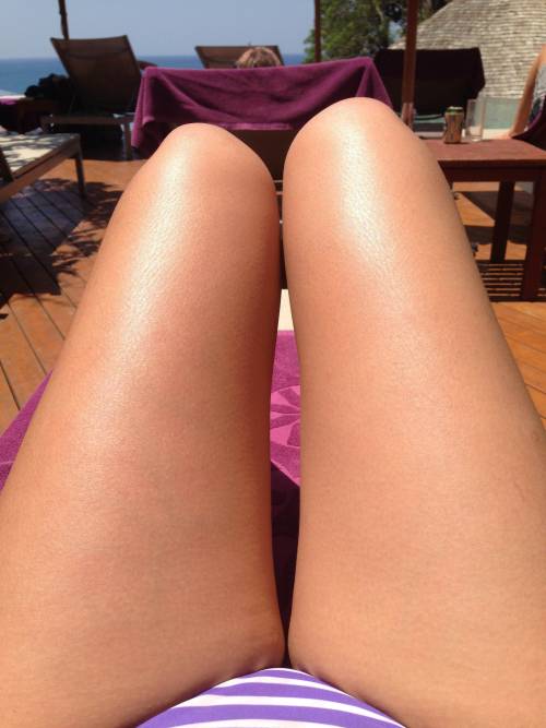 cosmicbabe91:  day 2 of poolside adventures - pt 1: legs up and ready to get my tan on.