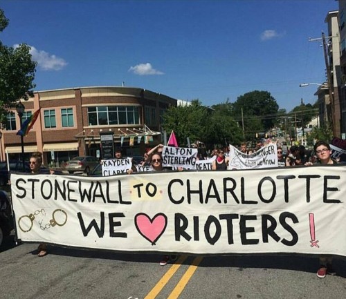 fuckyeahanarchistbanners: Durham, NC queers march during Durham Pride in solidarity with the rebels 