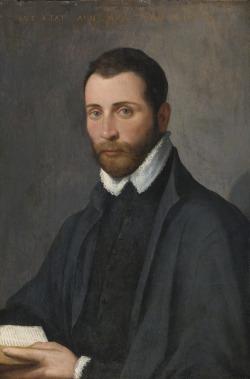 Attributed to Giovanni Battista Moroni (1520/24 (?)-after 1578), Portrait of a young man, half length, holding a book. Oil on panel, 64.8 by 44.5 cm.