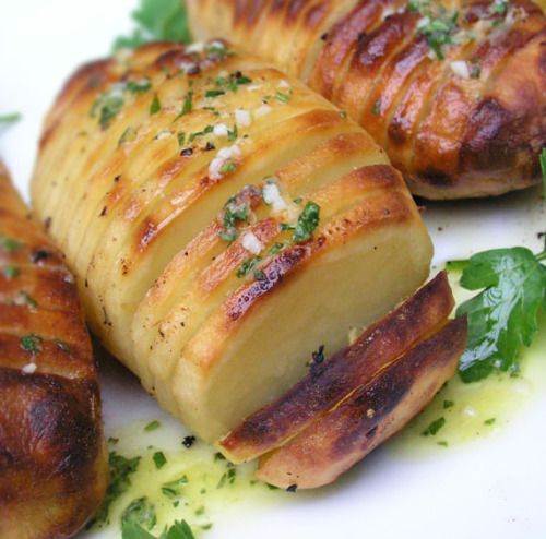 the-exercist:  Hasselback Potatoes from Panning the Globe:   5 large oblong shaped russet potatoes ⅔ cup olive oil 4 tablespoons lemon juice (1 or two lemons) 2 teaspoons dijon mustard (I like Grey Poupon) 2 teaspoons finely chopped garlic ½ teaspoon