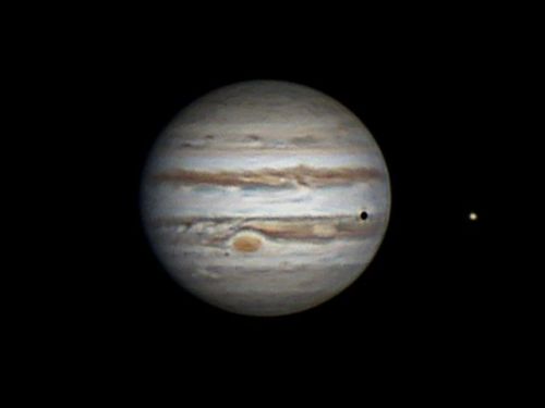 Saturn and JupiterYou can see Jupiter&rsquo;s moon, Io, casting a shadow onto the gas giant. &nb