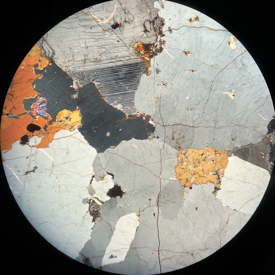 Optical Mineralogy — This rock is predominantly composed of quartz,...