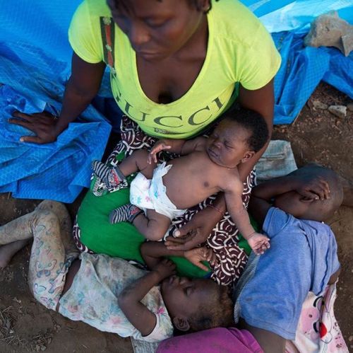 Baby Luisa was born in knee-deep floodwaters during Cyclone Idai. She sleeps on her mother’s l