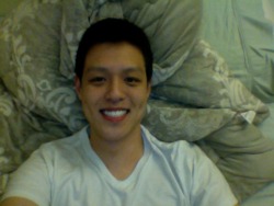 Cheesy smile in bed. There, happy anon?