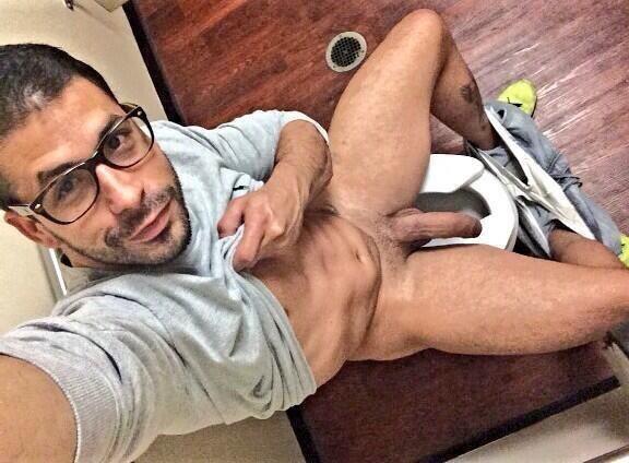 manly-muscular-machos:  HUNG HUNK:  Displaying his manhood while sitting on the