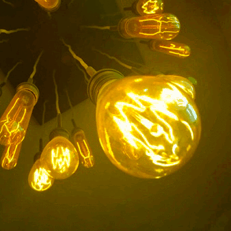 A bunch of yellow glowing light bulbs