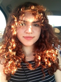 the sun lights my fiery curls