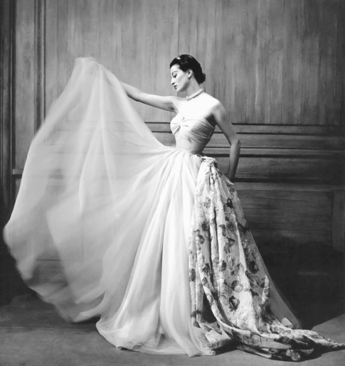 wehadfacesthen:Capucine modeling a voluminous gown by Pierre Clarence, 1953, photo by Georges Dambie