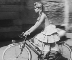 bardotinmotion:  It’s quite a trick to ride a bike in a ridiculously flouncy skirt! 