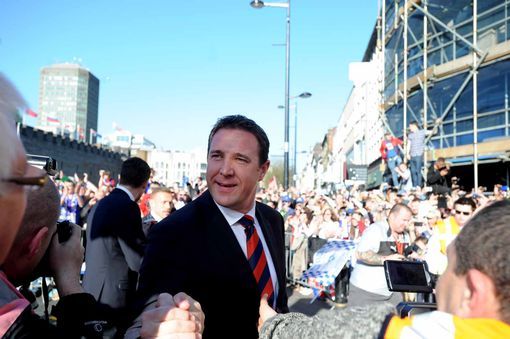 blue-madness-blue:  Cardiff City fans cheer their team on a day of sunshine celebrations