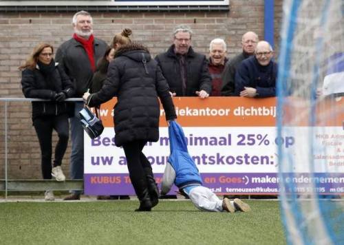 Mother get her young “hooligan-son” of the pitch during the game Hoek x Zwaluwen.