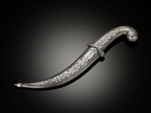 art-of-swords:  Jambiya Dagger Dated: 19th century Culture: Moroccan Measurements: Overall length: 14”; blade length: 8 1/4” This particular dagger features a beautifully detailed silvered hilt and scabbard, which protects the fine Damascus steel