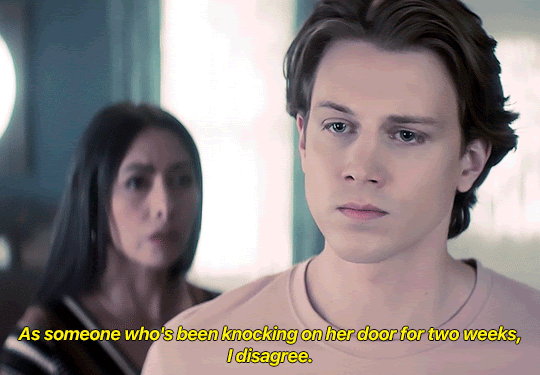 GIF FROM EPISODE 3X10 OF NANCY DREW. ACE IS STANDING IN THE HISTORICAL SOCIETY. HANNAH IS IN THE BACKGROUND BEHIND HIM. HANNAH SAYS "AS SOMEONE WHO'S BEEN KNOCKING ON HER DOOR FOR TWO WEEKS, I DISAGREE."