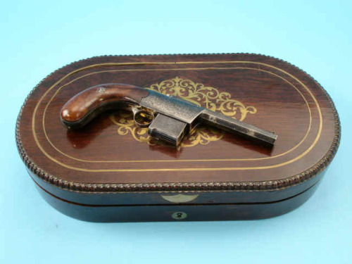 Rare 4 shot percussion harmonica pistol by H. J. Coyle, mid 19th century.