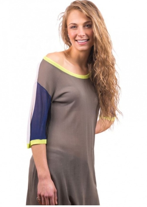 (via Celine Mystic Tunic) This sheer asymmetrical tunic features a round scoop neck and two tone blo