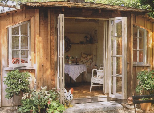 vintagehomecollection: The tool shed, expanded by the owner, serves as a dining pavilion for casual 