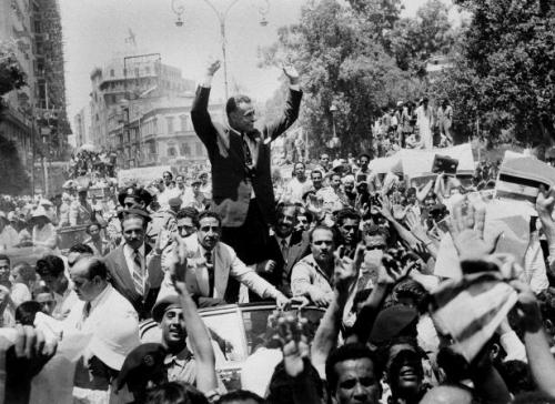 Gamal Abdel Nasser, ruler of Egypt, is greeted by a crowd after announcing that he would nationalize