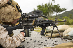 militaryarmament:  A bulk fuel specialist with Bulk Fuel Headquarters Company, 9th Engineer Support Battalion, 3rd Marine Logistics Group, III Marine Expeditionary Force. fires an M249 squad automatic weapon May 8, 2014, in the Central Training Area,