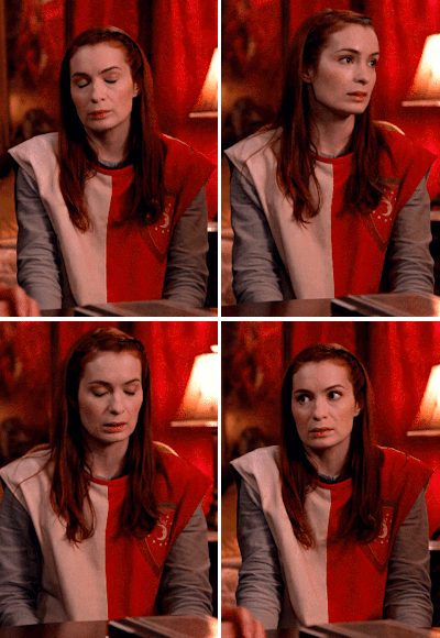 Four gifs of Charlie Brabury from Supernatural season 8 episode 11. Charlie is a light skinned woman with dark red hair. She's wearing a medival cosplay costume.