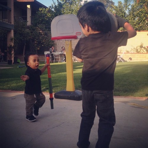 My little love, how&rsquo;d you get so big? Lennon on the bball court haha, with a watergun. #playti