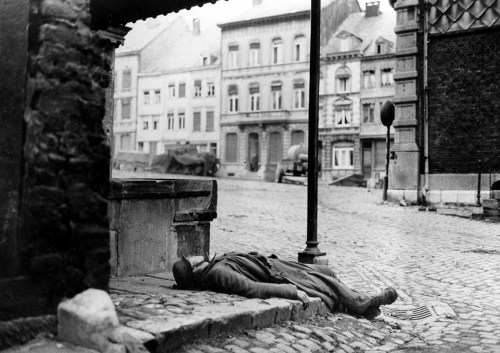 A dead Germansoldier on a street corner in Stavelot (Belgium, January 2nd,1945).   He was killed dur